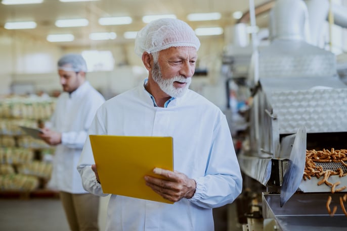 Man working at a food processing factory. 