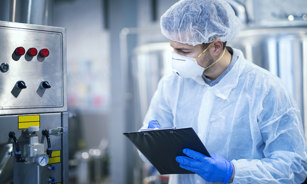 man-inspecting-equipment